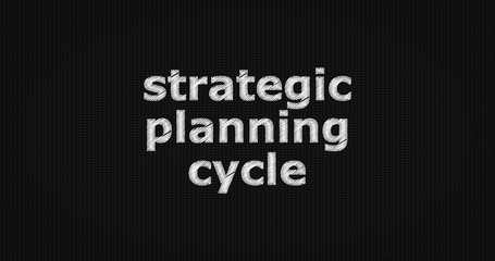 Strategic planning cycle word on grey background.