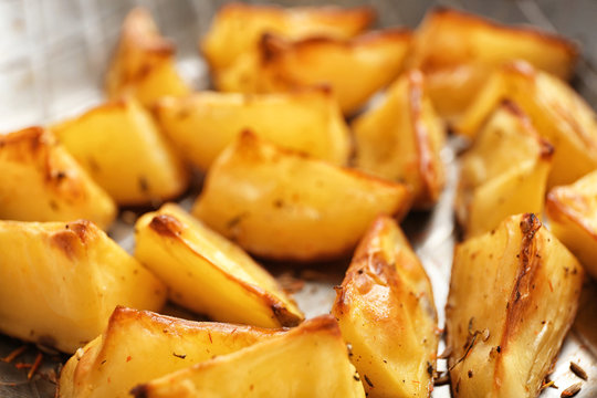 Delicious oven baked potatoes, closeup