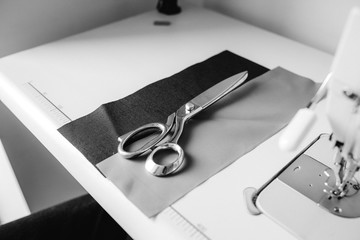 Scissors and cloth on the sewing table