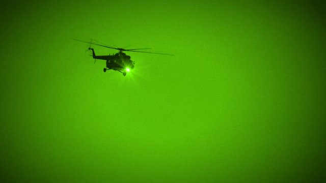 Military Helicopter Fly by in Night Vision