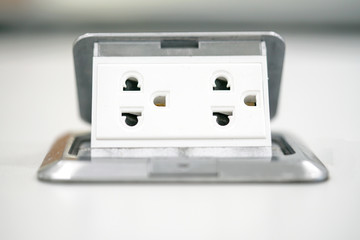 Electric power plug on table.