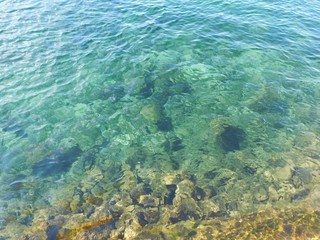 Fototapeta na wymiar Clear blue water of the St. Lawrence River