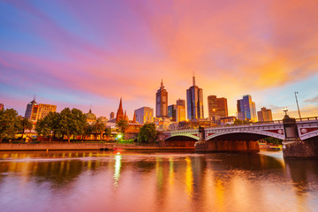 Fototapeta na wymiar A vibrant pink sunrise over Melbourne CBD