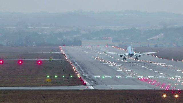 Airplane lands and security car enters the airport runway for inspection.