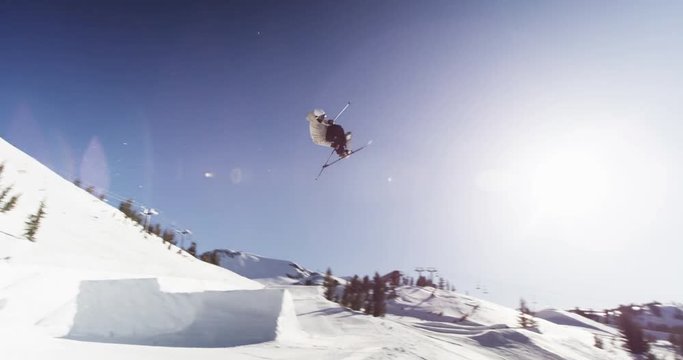 Low angle, skier spins in aerial trick