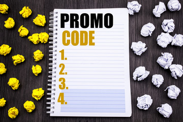 Conceptual hand writing text caption showing Promo Code. Business concept for Promotion for Online Business Written on notepad note notebook book wooden background with sticky folded yellow and white