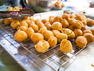 The merit making at the temple is a fusion of food, desserts and traditional Thai desserts. Abtract blur.