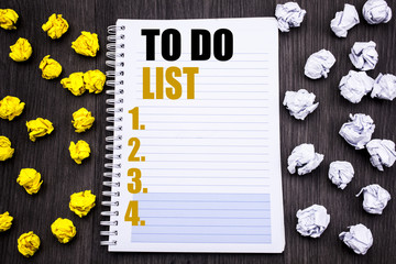 Conceptual hand writing text caption showing To Do List. Business concept for Plan Lists Remider Written on notepad note notebook book wooden background with sticky folded yellow and white