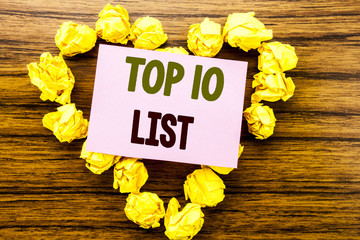 Word, writing Top 10 Ten List. Business concept for Success ten list written on sticky note paper on the wooden background.