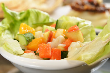 Fresh healthy salad  on dinner table 
