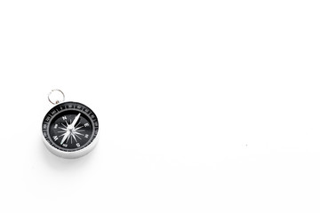 Compass on white background top view copy space. Black and white, contrast