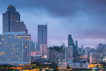 Modern city skyline at dusk in Bangkok.
