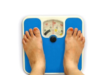 Women foot on weighing scale