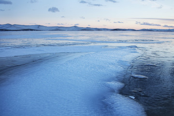 Wavy ice of Lake Baikal, winter landscape.