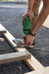 man worker working with an electric drill