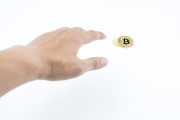 Fototapeta na wymiar Bitcoin. Blur hand find gold bitcoin on isolated background.