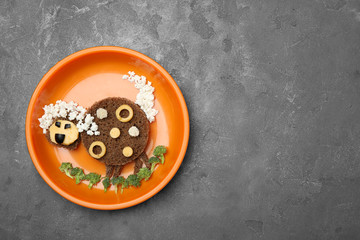 Creative breakfast for children on grey background, top view