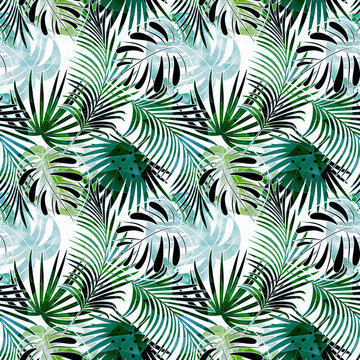 Seamless  tropical pattern. Colorful leaves, palm leaves on a light background.