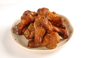  Grilled chicken legs with cumin on white background