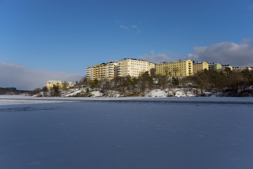 Obraz premium A snowy, cold and sunny view of the island Kungsholmen in Stockholm