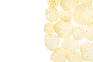 Yellow potato chips as decorative border on white background, isolated, top view.