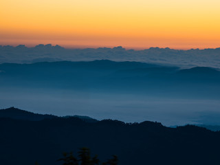 The sun rises on the top of the hill