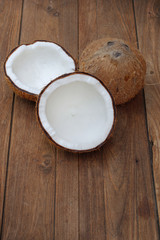 Coconut isolated on the wooden background. Tropical fruit coconut