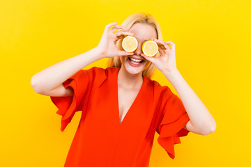 Blonde woman in dress with lemons