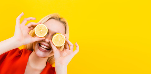Blonde woman in dress with lemons