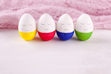 group of funny colorful eggs - a concept of merry Easter, funny characters, emotions