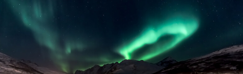 Aurora Borealis (northern lights) above mountains Kaldfjord  - Kvaloya, north Norway