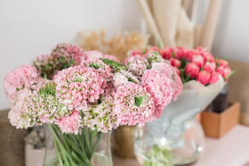 Persian buttercup. lace with many petals. Bunch pale pink ranunculus flowers light background. Wallpaper