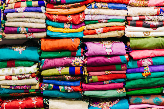 Colorful stacks of indian sari. Indian market. 