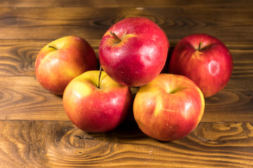 Red apples on wooden table