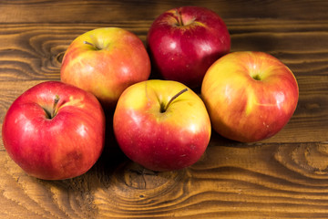 Red apples on wooden table