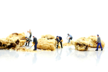 Miniature people : children and student  with cookies,play and education concept.
