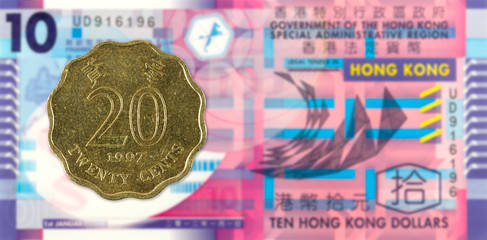 20 hong kong cent coin (1997) against 10 hong kong dollar bank note obverse