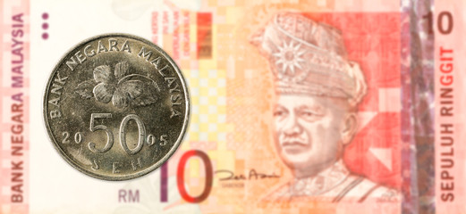 50 malaysian sen coin against 10 malaysian ringgit bank note obverse © Henning Marquardt