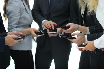 closeup.business team using smartphones .