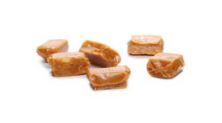 Caramels, pieces isolated on white background