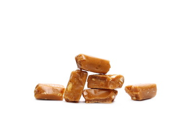 Caramels, pieces isolated on white background