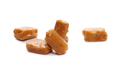 Caramels, pieces isolated on white background