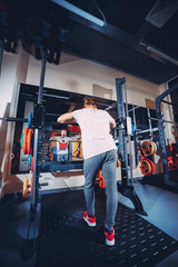 Man rests in gym after having a workout