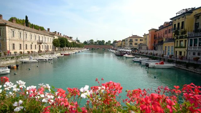 Port of Peschiera del Garda - town and commune near Venice , Italy .
