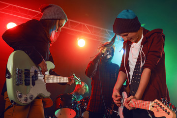 Teenagers are playing rock.