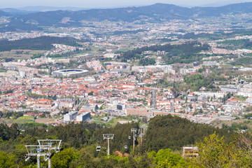 Fototapeta na wymiar View out across the city of Guimaraes from Mount Penha in northern Portugal