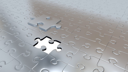 One Silver Puzzle Piece above all other Silver Puzzle Pieces with one missing piece