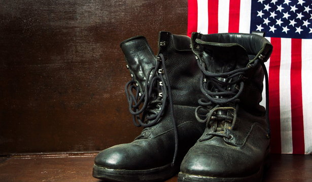 Old military boots and USA flag