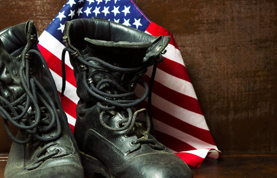 Old military boots and USA flag