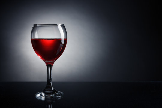 A glass of red wine closeup.